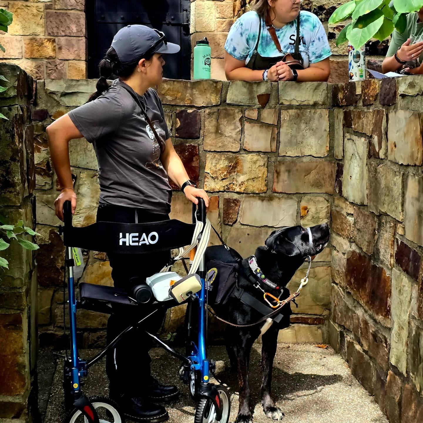 Sit Service Dog owner with their service dog at the zoo