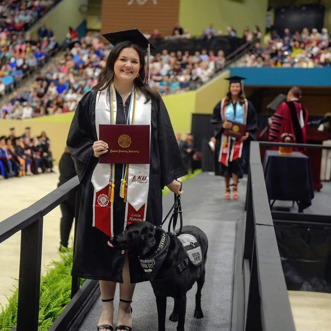 Sit Service Dog owener and her service dog at SIUC Graduation